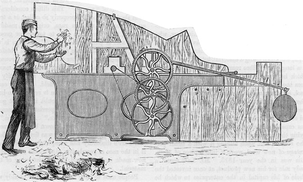 Placing sorted woollen rags in a grinding machine called a Devil