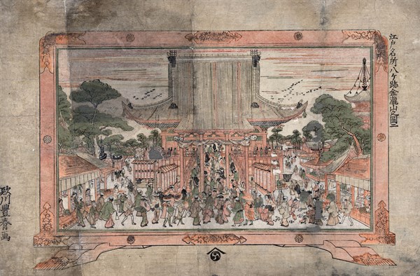People entering a large temple