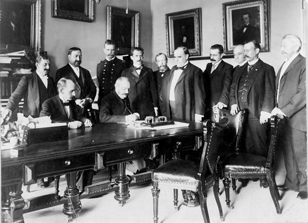 French Ambassador Pierre Paul Cambon signing the Peace Protocol