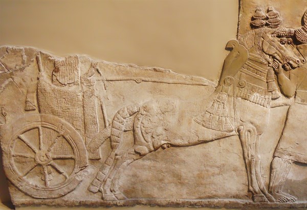 Chariot with wheel depicted in a stomne relief from Nimrud