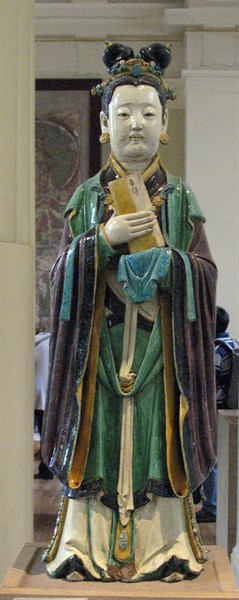 Stoneware figure from a judgement group with aubergine