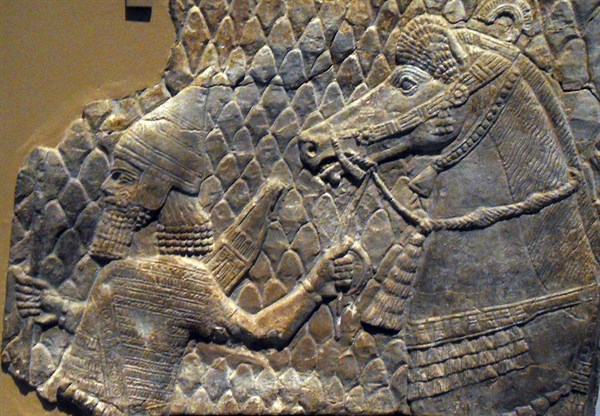 Assyrian relief showing a horse led by an archer