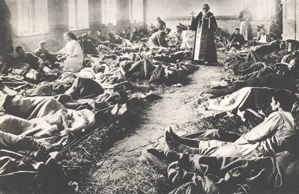 Orthodox priest in a Russian military hospital ward