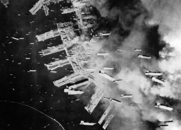 The Japanese port of Kobe is bombed by US aircraft