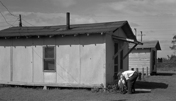 camp used by migrant citrus workers. Some migrants cannot afford to rent such houses, and live in tents or crude homemade trailers. Winterhaven, Florida 19370101