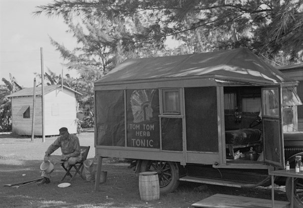 One-legged medicine man encamped with the migrant fruit and vegetable workers at Belle Glade, Florida, dated 19370101