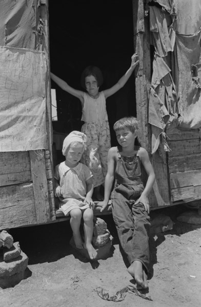 Children of agricultural day labourer . The father, an oil field worker, had deserted the family. The shack was near Vian, Oklahoma 19390101