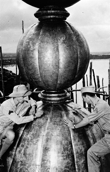 Photograph of Corporal Anthony J. Scopelliti, and Private First Class John C. Byron, Jr. on top the Taj Mahal dome