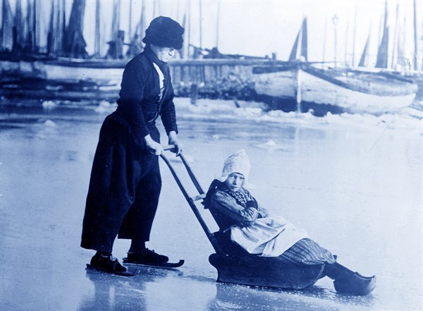 In Holland. Photo possibly shows boy and girl in Volendam