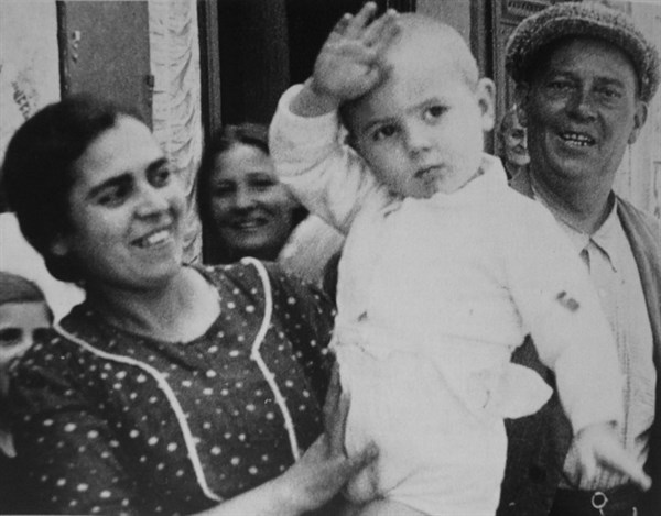 Nationalist supporters salute soldiers during the Spanish Civil War