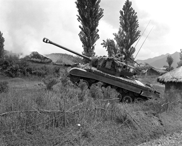 US Marine Corps Pershing tank at the edge of a village in Korea, 4 Sep 1950