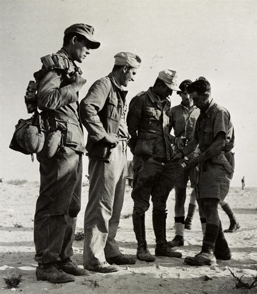 German prisoners being searched after being captured south of El Alamein