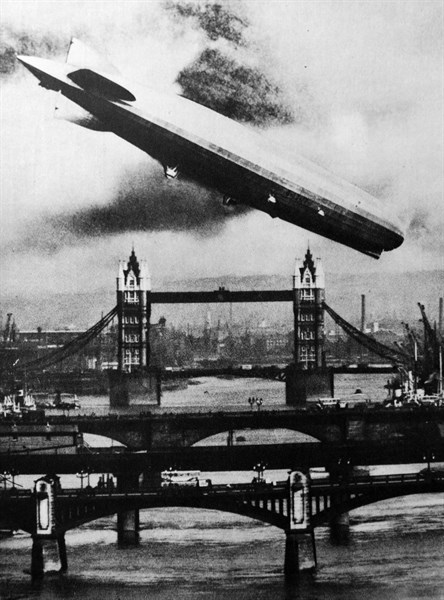 The German airship the Graff Zeppelin flies over Tower Bridge