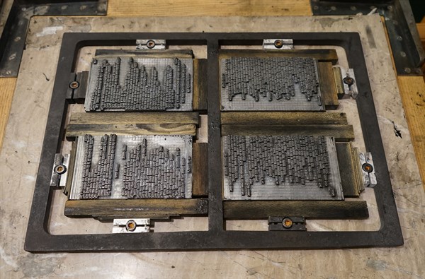 Metal plate with letters set to print