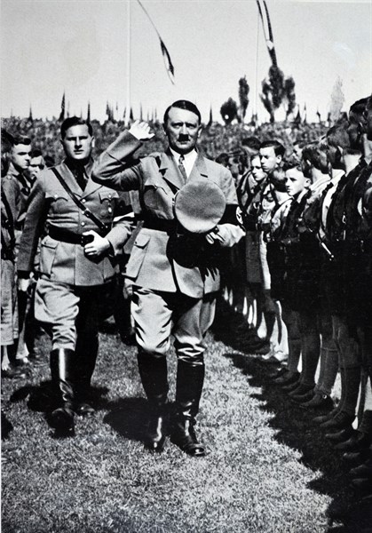 Adolf Hitler, salutes Hitler Youth Rally