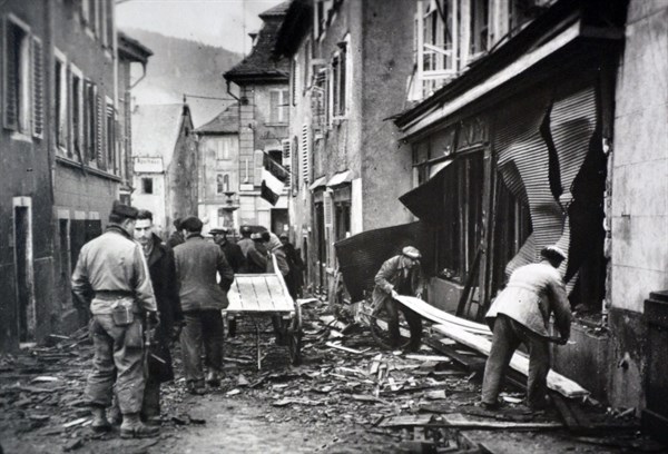 Citizens attempt to clear damaged buildings in Alsace Lorraine, 1944