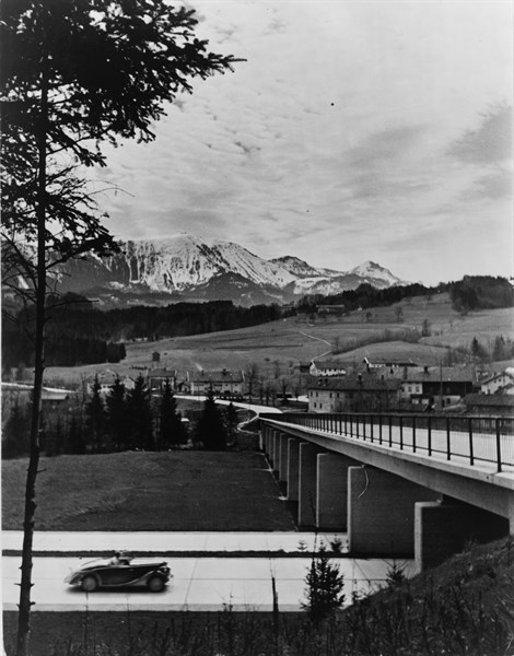 Automobile approaching overpass on the Autobahn