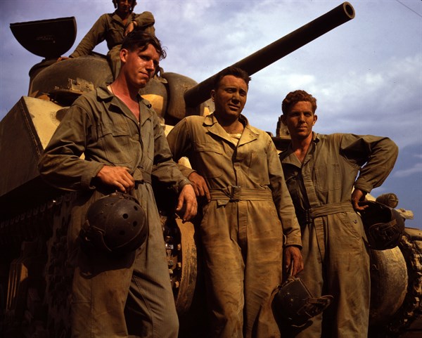 US Army tank crew standing in front of an M-4 tank
