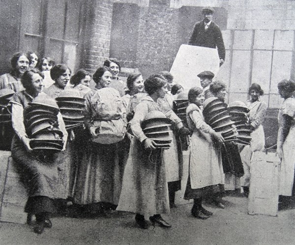Loading soldiers helmets for delivery to the front line