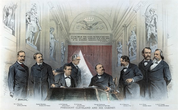 President Cleveland sitting at a desk between his cabinet members