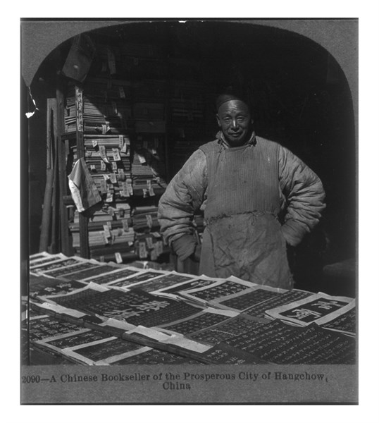 Photograph of a Chinese bookseller of the prosperous City of Hangchow, China.