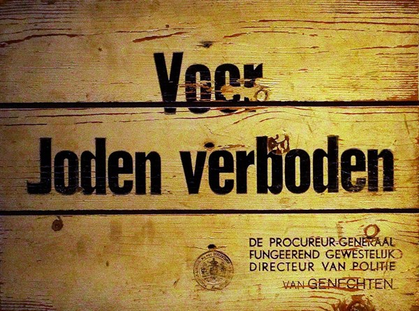 A sign saying 'Forbidden for Jews' issued by the Director of Police