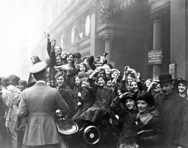 London; England. crowds celebrate the Armistice at the end of WWI 1918