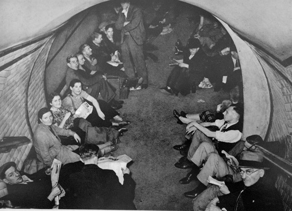 Civilians take shelter in a London Undergroud rail station during the air raids of the German Blitz 1940
