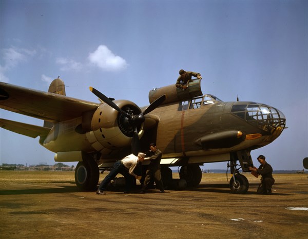 Colour photograph of the servicing of an A-20 bomber