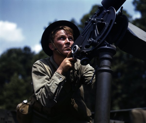 Colour photograph of a private of the armed forces practicing his shooting