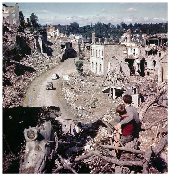 Photograph of French boys observing Allied vehicles 1944