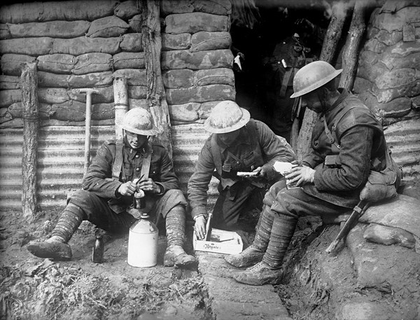 Canadian soldiers resting in a trench