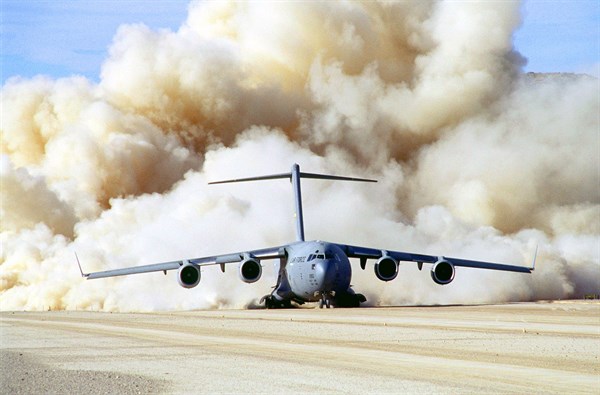Clouds of dust behind US Air Force C-17 Globemaster III