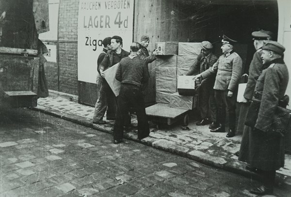 Photograph of supplies being loaded into a German Army store in Paris, during the Invasion of France in 1940 in World War Two