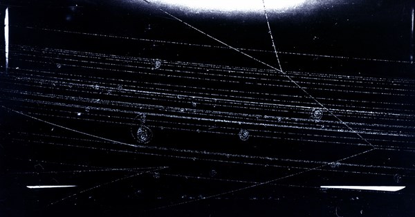 Photograph of a Bev Proton from the Cosmotron colliding with a proton in the liquid hydrogen bubble chamber