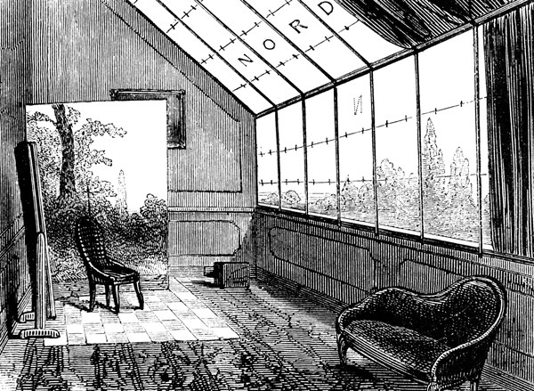 A small photographer's studio, showing a backdrop, and mirror to reflect light on to the subject