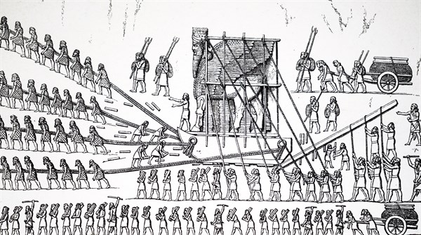 Assyrians manoeuvring a huge statue into place by means of rollers and leverage