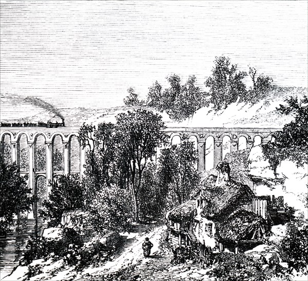 A train crossing viaduct near a remote farmstead