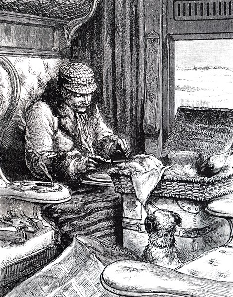 A man in a first class carriage preparing to eat his lunch