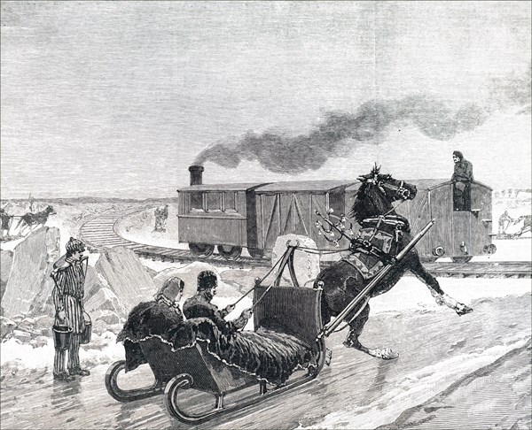 A train running on tracks laid on the ice of the Saint Lawrence River