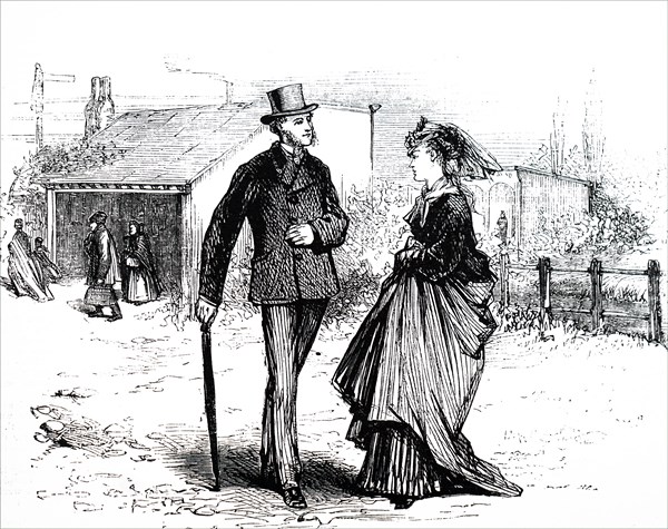 A couple outside of a country railway station