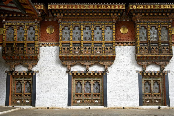 Gorgeous ornate windows and bay window in the Punakha Dzong monastery fortress