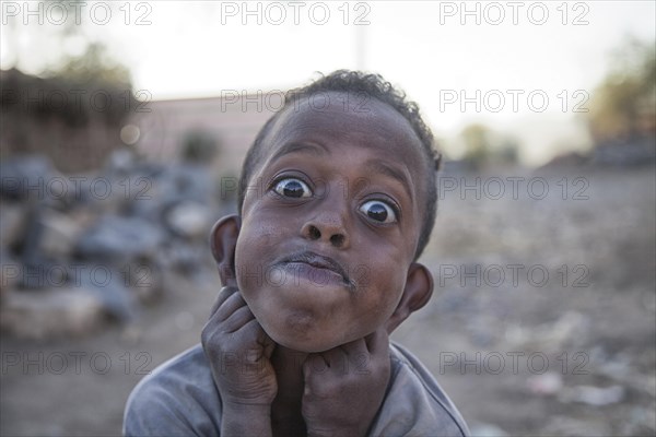 Child pulls grimace