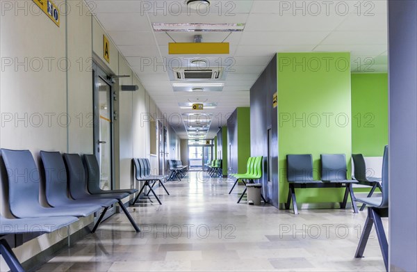 Corridor with chairs for patients in a modern hospital