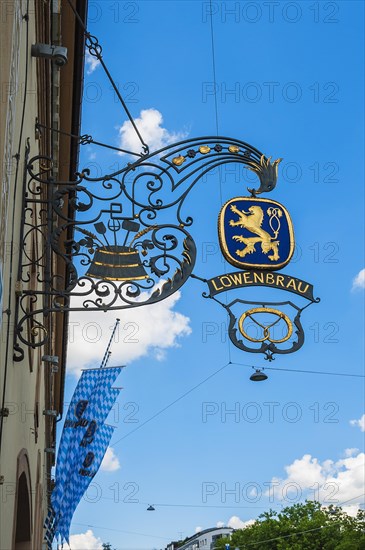 Wrought iron shop sign and flags