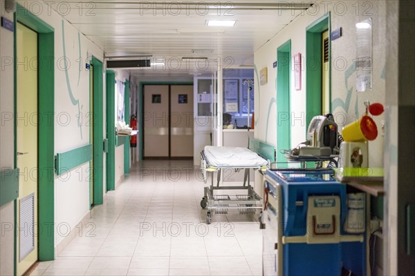 Hospital corridor with a bed waiting for the next patient