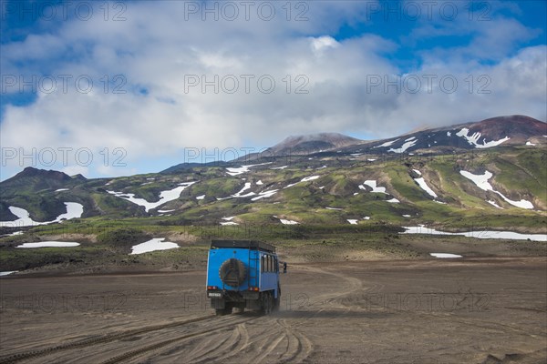 Truck driving through the lava sand