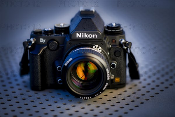 DSLR Nikon Df with Nikkor AI-S 50mm 1.2 in retro style