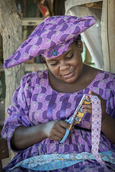 Native Herero woman with typical headgear and clothes