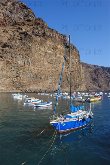 Fishing boats and sailing boat in the port